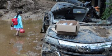 Indonesia landslides and flash floods kill at least 27 – with rescuers searching for vehicles trapped in mud | World News