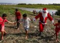 Santa Claus Braves Amazon Jungle To Bring Gifts To Children