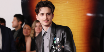 Elle Fanning Is Straight Out Of The 60s In Gucci Gown And Pigtails