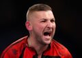 World Darts Championship: Nathan Aspinall earns nervy win as Christian Kist hits nine-darter in defeat | Darts News