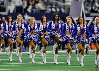 Dallas Cowboys Cheerleader Knocked Down By Football