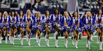 Dallas Cowboys Cheerleader Knocked Down By Football