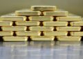 Gold price hits record high on looming US tariff fears
