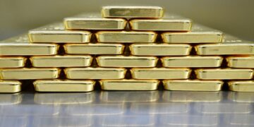 Gold price hits record high on looming US tariff fears