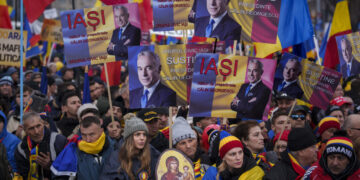 Romanian far-right supporters hold protest rally ahead of election re-run
