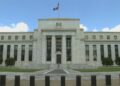 US Federal Reserve holds rates steady, but warns of inflation and slowing growth