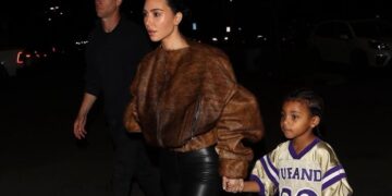 Kim Kardashian Stepped Out with her Son Psalm West in a Brown Fur Bomber Jacket with Black Leather Leggings
