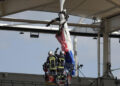 Bungled entry leaves French paratrooper dangling from rugby stadium roof