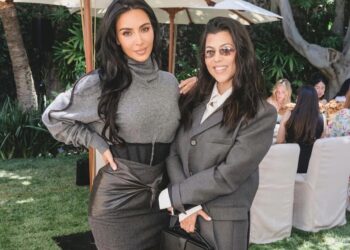 Kim Kardashian Celebrates Law School Graduation in Gray Sweater and a Black Vintage Versace Corseted Skirt