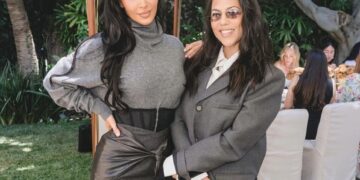 Kim Kardashian Celebrates Law School Graduation in Gray Sweater and a Black Vintage Versace Corseted Skirt