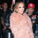 Jennifer Lopez Wore a Peach $835 “The New Arrival” Dress with a Feather Bolero and FEMME LA Heels to the Ring Them Bells benefit Concert in New York