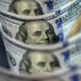 Dollar sinks to three-year low on Trump tariff threat