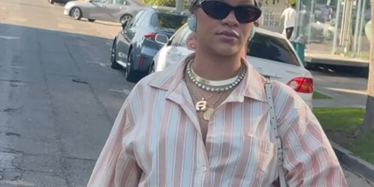 Rihanna Spotted in LA Wearing a Striped Savage x Fenty Pajama Set and Blush Satin Maison Margiela Tabi Ballet Flats