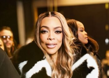 Wendy Williams Spotted at LaQuan Smith NYFW Show win a Black and White Fur Coat with Black Mini Shorts and a Snakeskin Hermes Bag