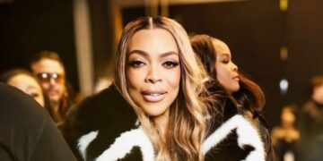 Wendy Williams Spotted at LaQuan Smith NYFW Show win a Black and White Fur Coat with Black Mini Shorts and a Snakeskin Hermes Bag