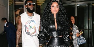 Keyshia Ka’Oir Stepped Out with Gucci Mane in a Black Norma Kamali Leather Jacket and Pleated Mini Skirt