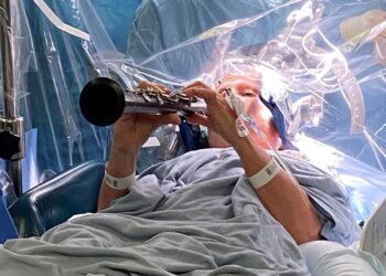 Parkinson’s patient plays clarinet during brain surgery | UK News