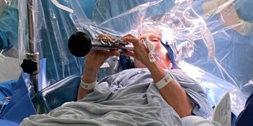 Parkinson’s patient plays clarinet during brain surgery | UK News