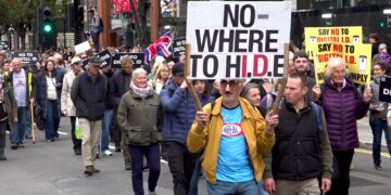 Thousands of protesters march through London streets against digital ID plans | UK News