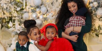 Cardi B Celebrates Christmas with Her Children in an Olive Green Bodycon Dress with Silver Metallic Heels