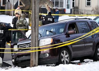 ICE Shooter’s Unmasked Face Went Viral Almost Immediately. It Was AI.