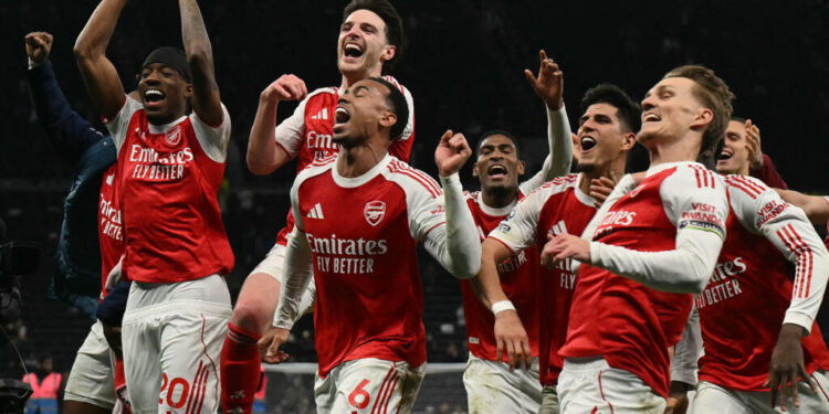 Premier League: Arsenal pass derby test of nerve against Tottenham