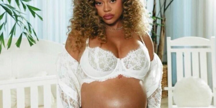 Latto Debuts Baby Bump in White Lace Lingerie and Polka Dot Set in “Business and Personal (Intro)” Video